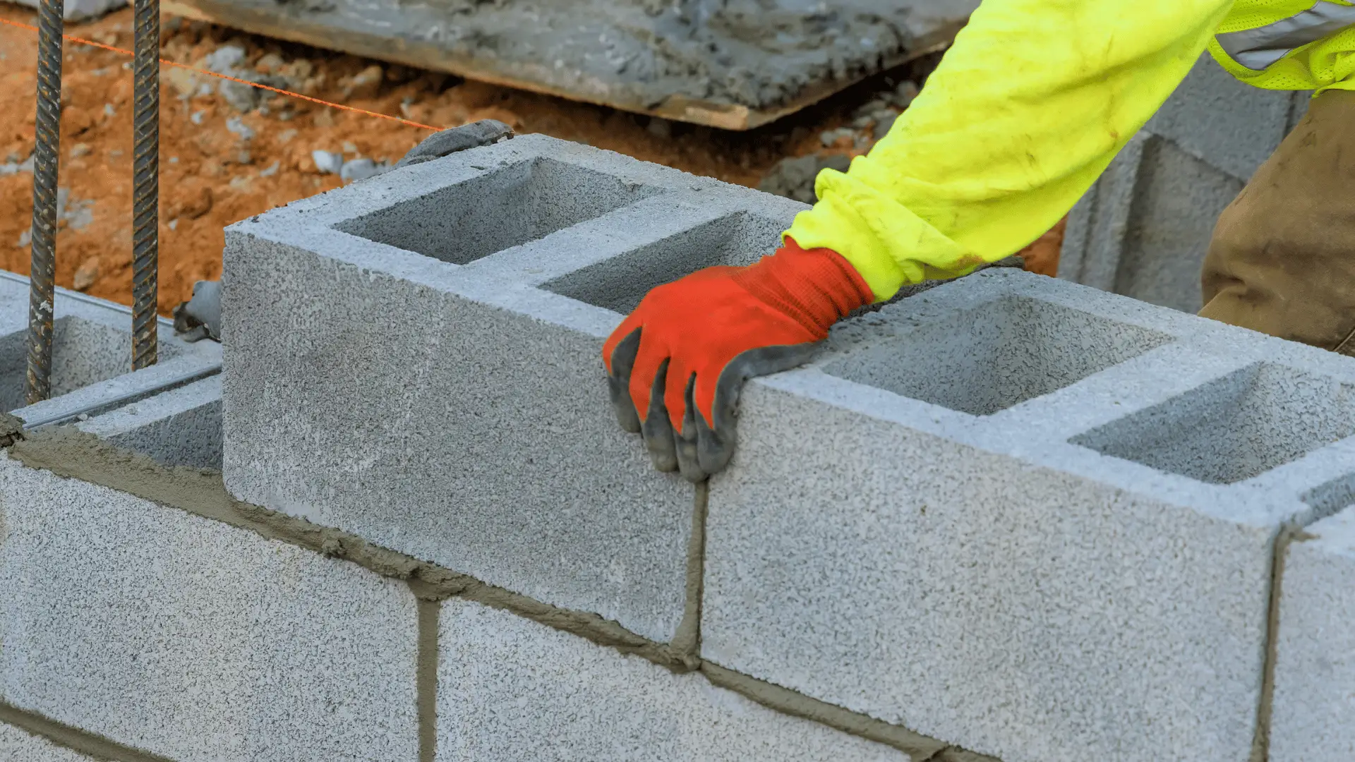 Concrete retaining wall being built by New Beginnings Concrete.